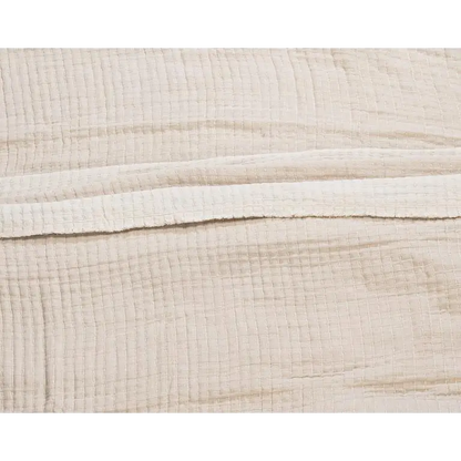 Close-up of textured beige Kantha cotton bed cover fabric layers and stitching - PABOOM