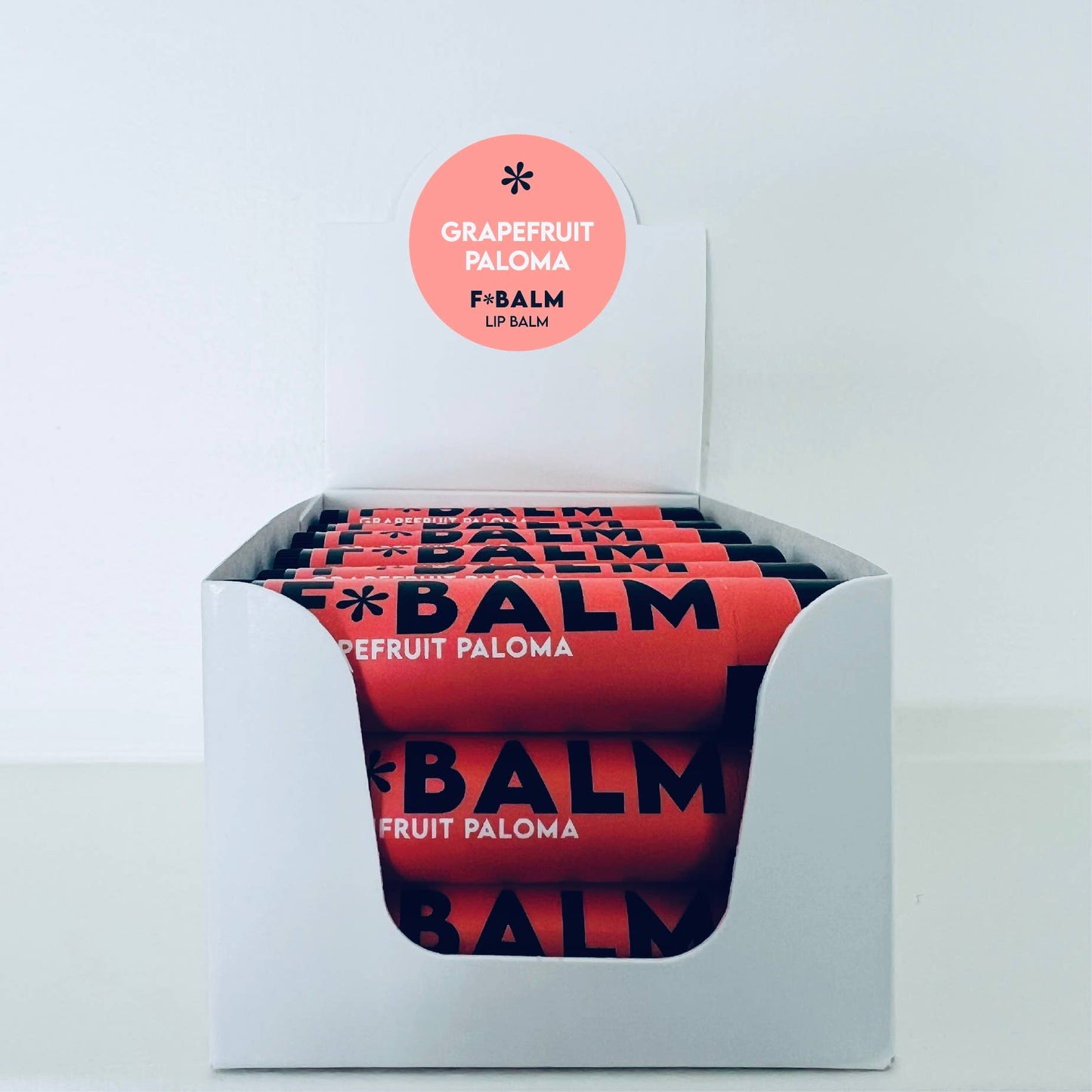 Charleston & Harlow Grapefruit Paloma lip balm cap removed showing balm