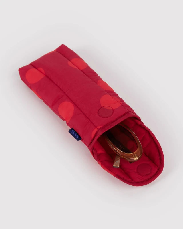 BAGGU Puffy Glasses Sleeve in red polka dot shown open to reveal the interior