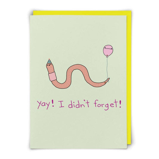 Mint green card with a pink worm in a party hat holding a balloon, text 'Yay! I didn't forget!' - PABOOM