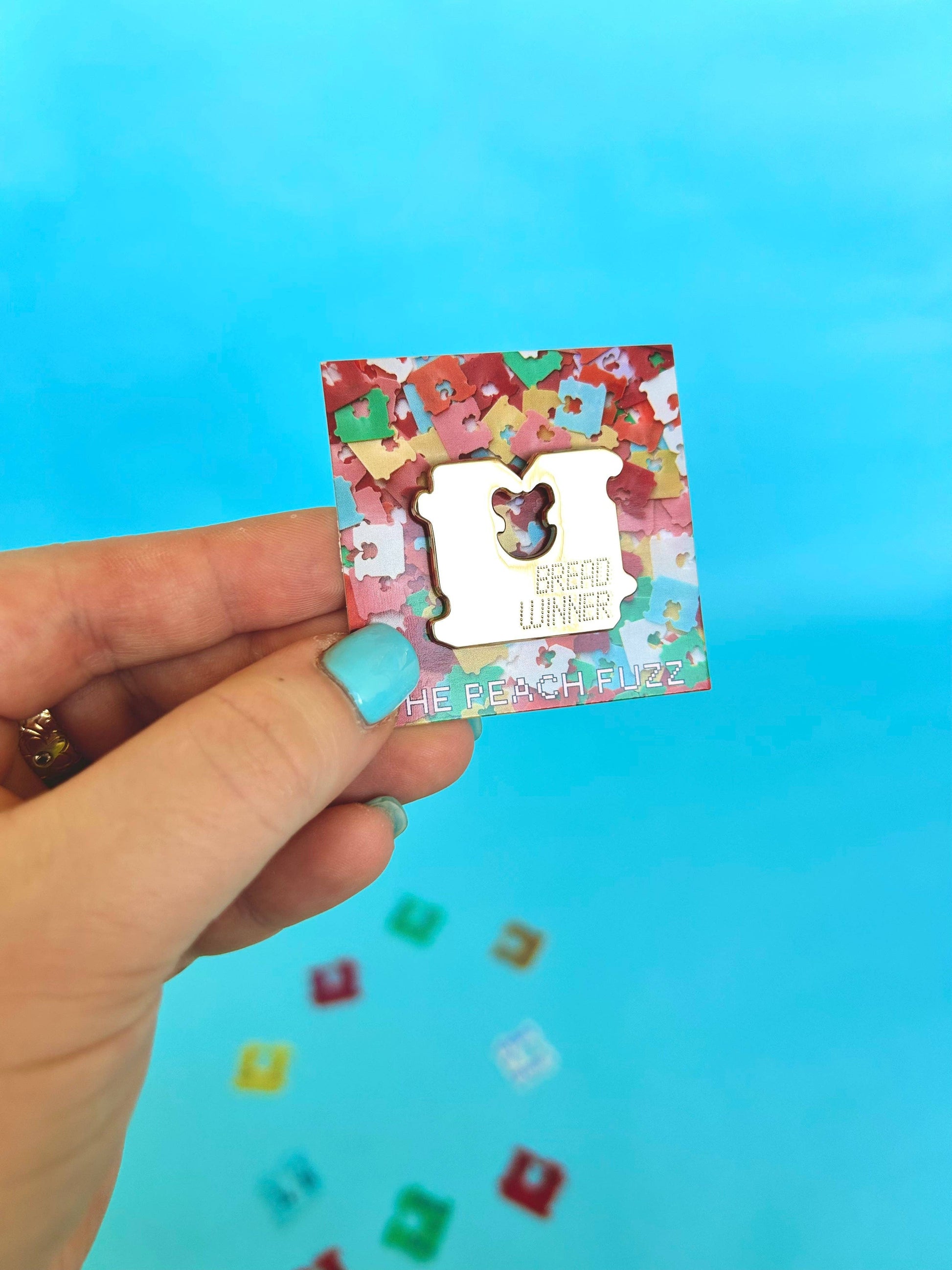 Bread Winner pin packaging shown from the back