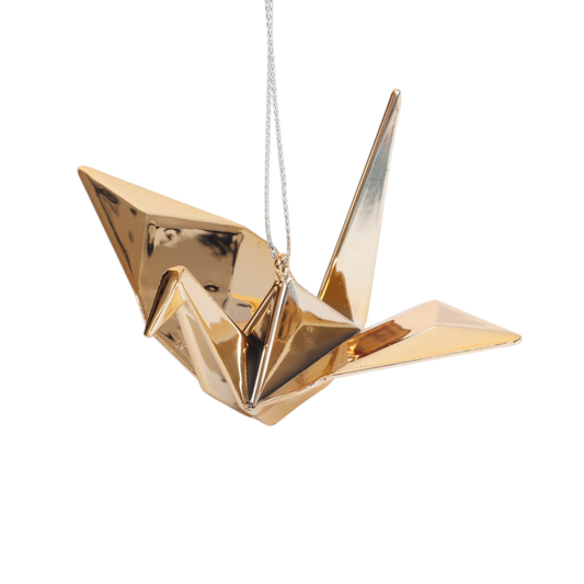 Shiny metallic gold origami crane ornament hanging from a silver cord - PABOOM