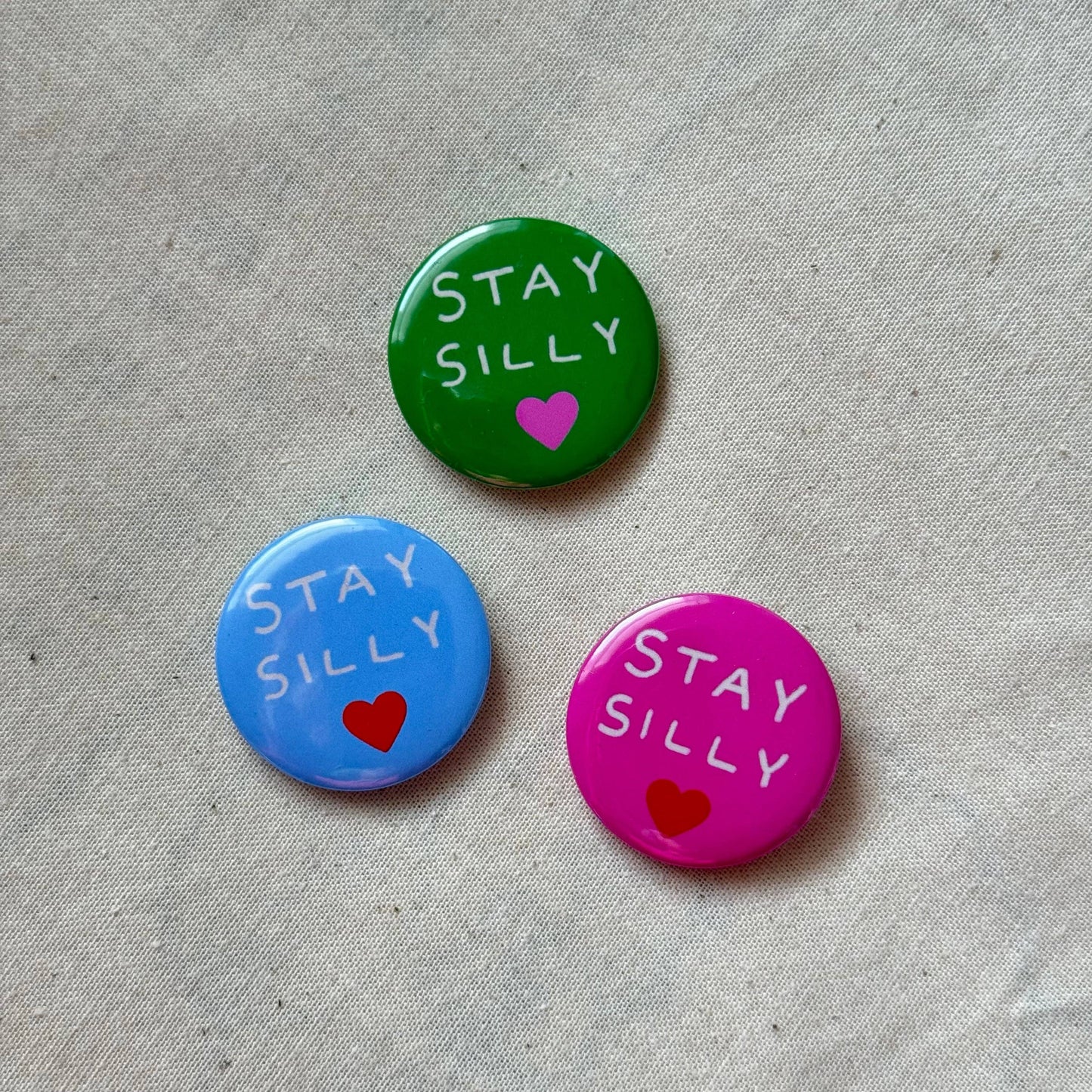 Green Stay Silly badge close-up detail - PABOOM