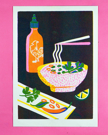 Risograph print of a steaming bowl of pho with chopsticks, sriracha and lime on a pink background - PABOOM