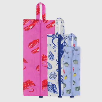 Flat lay of BAGGU 3D Zip Set Sea Creatures pouches showing size comparison of large, medium, and small pouches - PABOOM