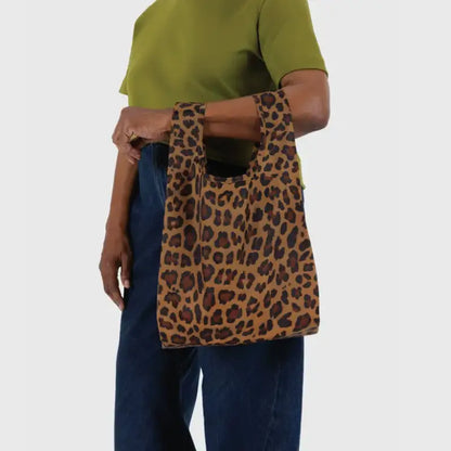 Baby Baggu with leopard pattern being held on the arm - PABOOM