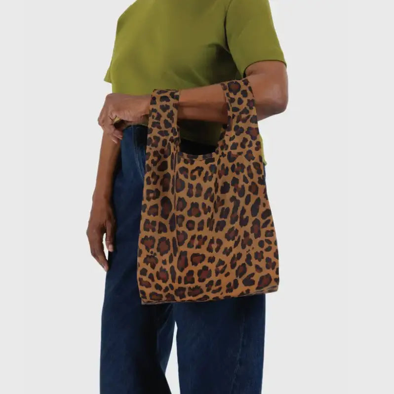 Baby Baggu with leopard pattern being held on the arm - PABOOM