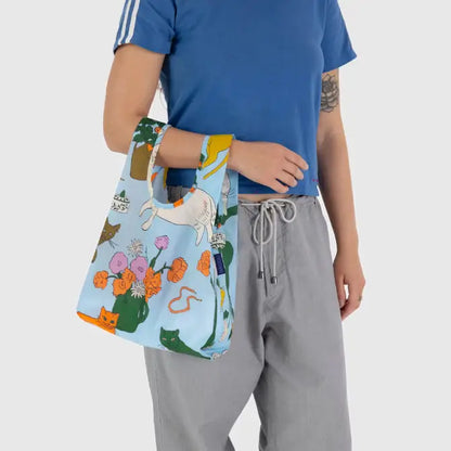 Baby Baggu bag featuring cats and flowers being held on the arm - PABOOM