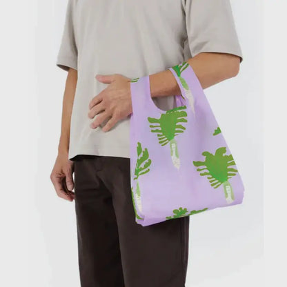 Baby Baggu bag featuring a pattern of radishes being held on the arm - PABOOM