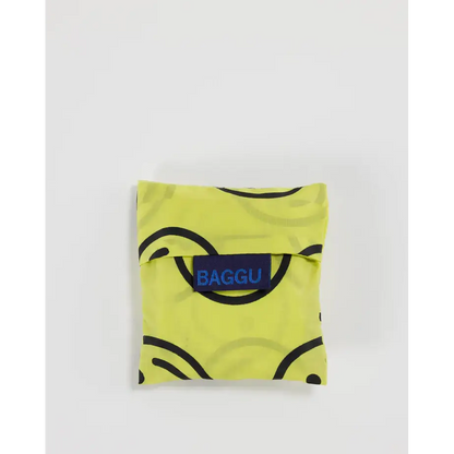 Baby Baggu bag with smiley face pattern being folded into a pouch - PABOOM