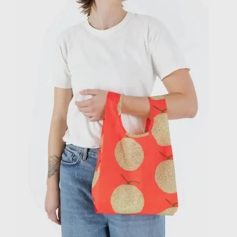 Baby Baggu bag featuring a pattern of melons being held on the arm - PABOOM