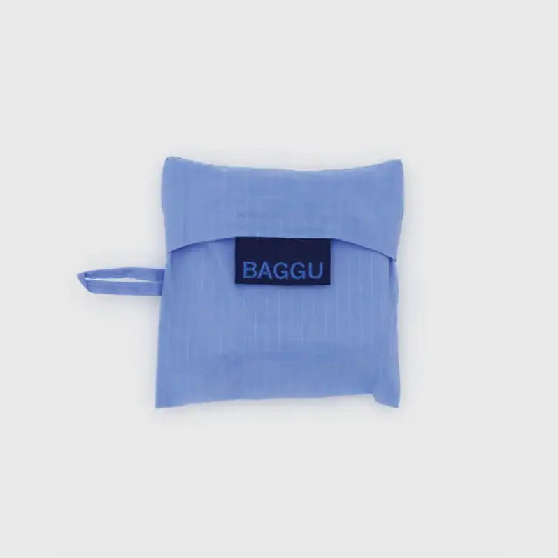 Pale blue Baby Baggu bag being folded into a pouch - PABOOM
