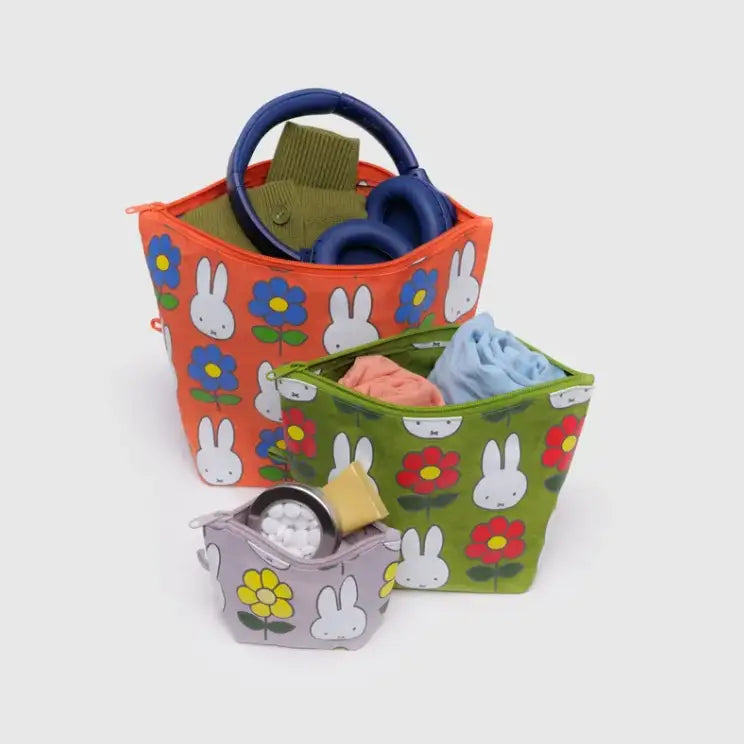 Open BAGGU Go Pouch Set filled with travel items and accessories - PABOOM