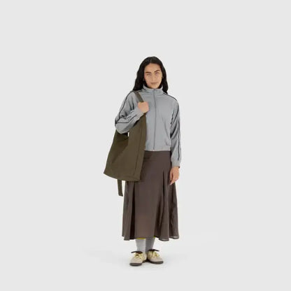 Full outfit view with BAGGU Large Nylon Sling Seaweed worn crossbody - PABOOM