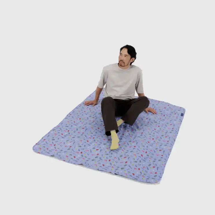 Baggu Person sitting on Puffy Picnic Blanket Sea Charms print - PABOOM