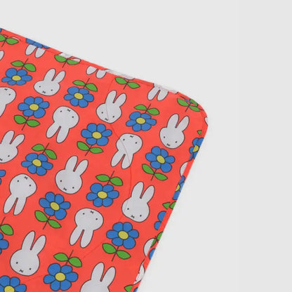 BAGGU Close-up corner of Miffy Puffy Picnic Blanket with bunny and flower print - PABOOM