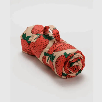 Quilted puffy picnic blanket rolled up with carrying strap for easy transport - PABOOM