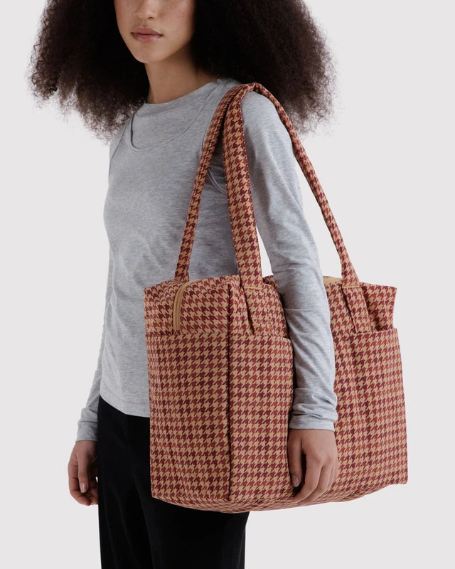 Interior view of the BAGGU Small Cloud Carry-On in tan houndstooth showing the detachable storage pouch