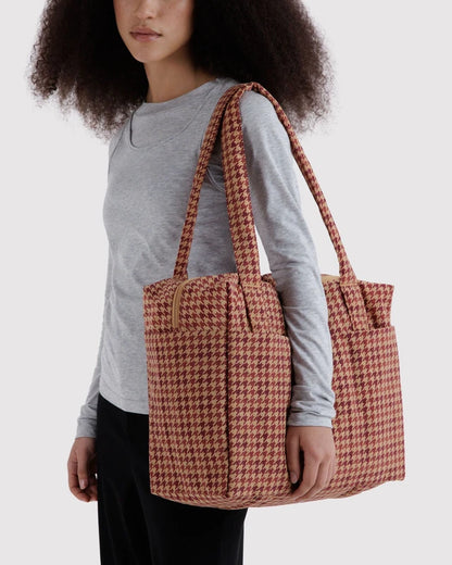 Interior view of the BAGGU Small Cloud Carry-On in tan houndstooth showing the detachable storage pouch