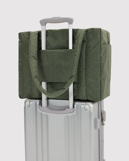 BAGGU Small Cloud Carry-On in caper green shown flat to highlight its exterior pockets