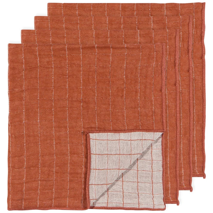 Stack of five folded rust-orange cotton napkins with a plush double-weave texture – PABOOM