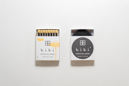 Hibi Yuzu incense matches in a white box with yellow accent, open to show matchsticks beside a closed box - PABOOM