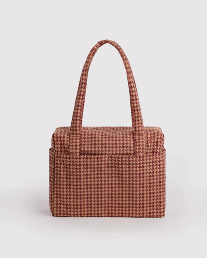BAGGU Small Cloud Carry-On in tan and rust houndstooth print, shown from the front with top handles