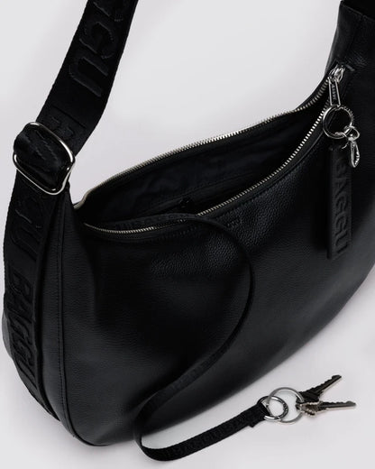 BAGGU Medium Recycled Leather Flat Crescent bag shown from the side to highlight its silhouette