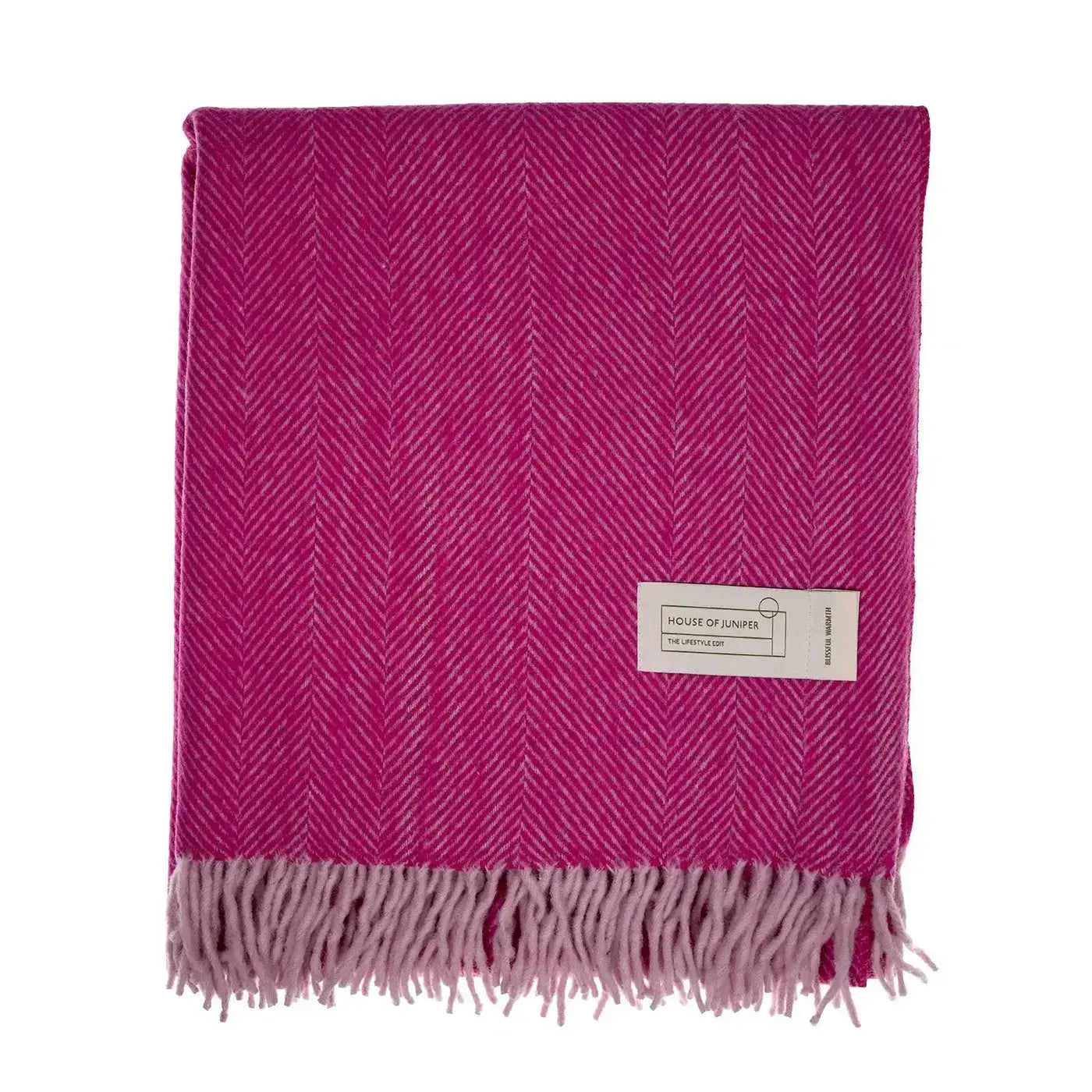 Folded Pink herringbone wool throw blanket in magenta with pale pink fringe and House of Juniper label - PABOOM