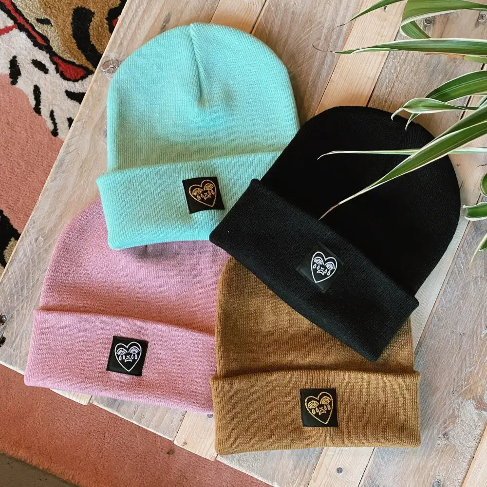 Cousins Collective - Crying Heart Classic Beanie Peppermint / Gold + Black - four knitted beanies light blue