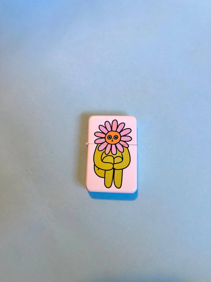 Flower Boy lighter styled in grass