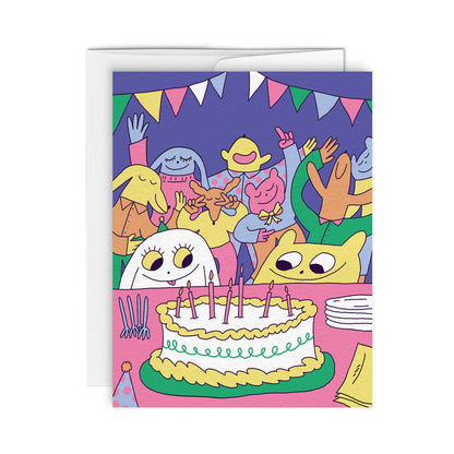 Colorful illustrated characters celebrating around a birthday cake with candles and bunting