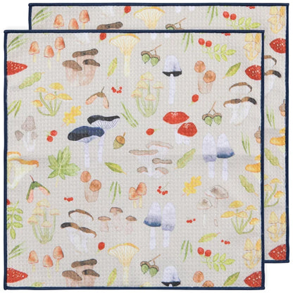 Two layered cream microfibre dishcloths printed with an all-over pattern of watercolour mushrooms and acorns – PABOOM
