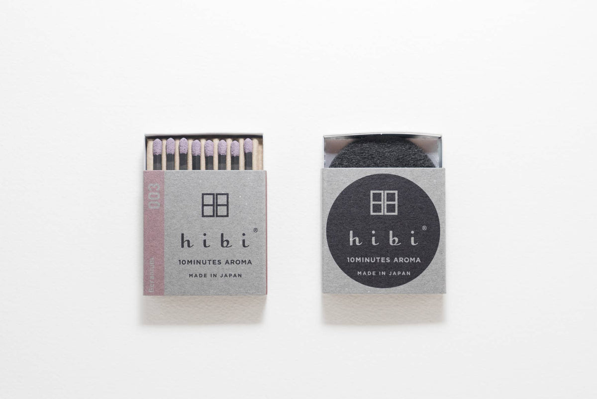 Hibi Geranium incense matches in a soft pink box, open to show matchsticks beside a closed box - PABOOM