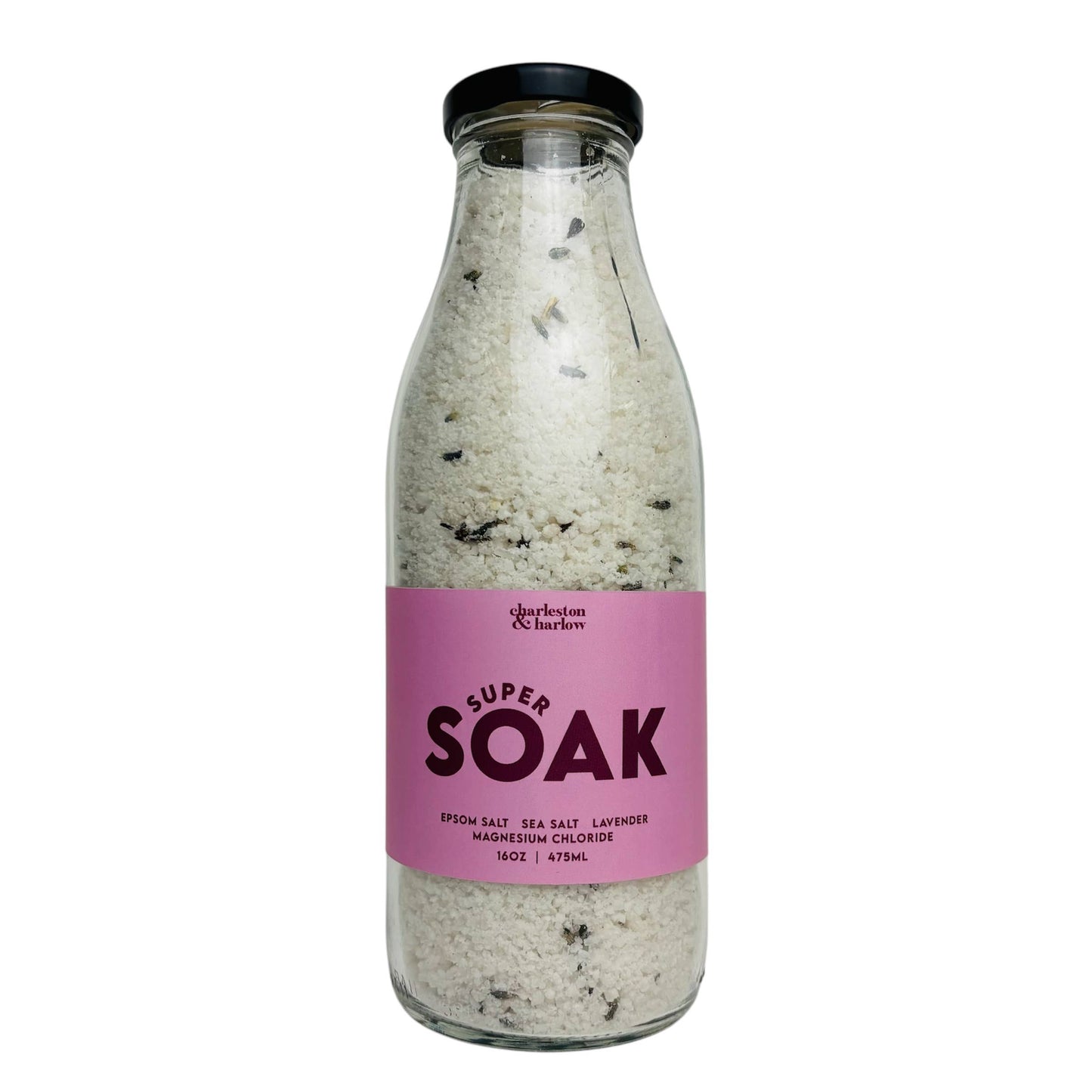 Glass bottle of Charleston & Harlow Super Soak bath salts with mauve label, magnesium and dried lavender buds visible in the salt