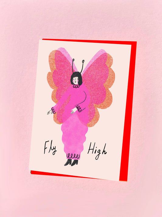 Kitty Kenda greeting card illustrating a pink winged moth fairy character with "Fly High" text