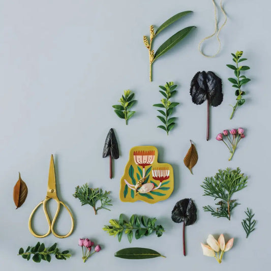 Venus tray surrounded by flowers and leaves