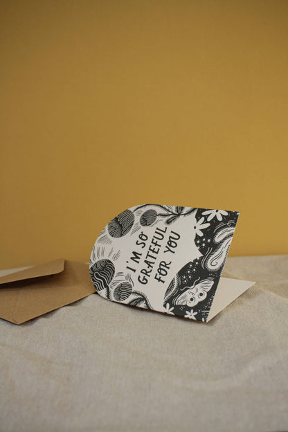 Close-up of the botanical linework and hand-lettered text on the thank you card
