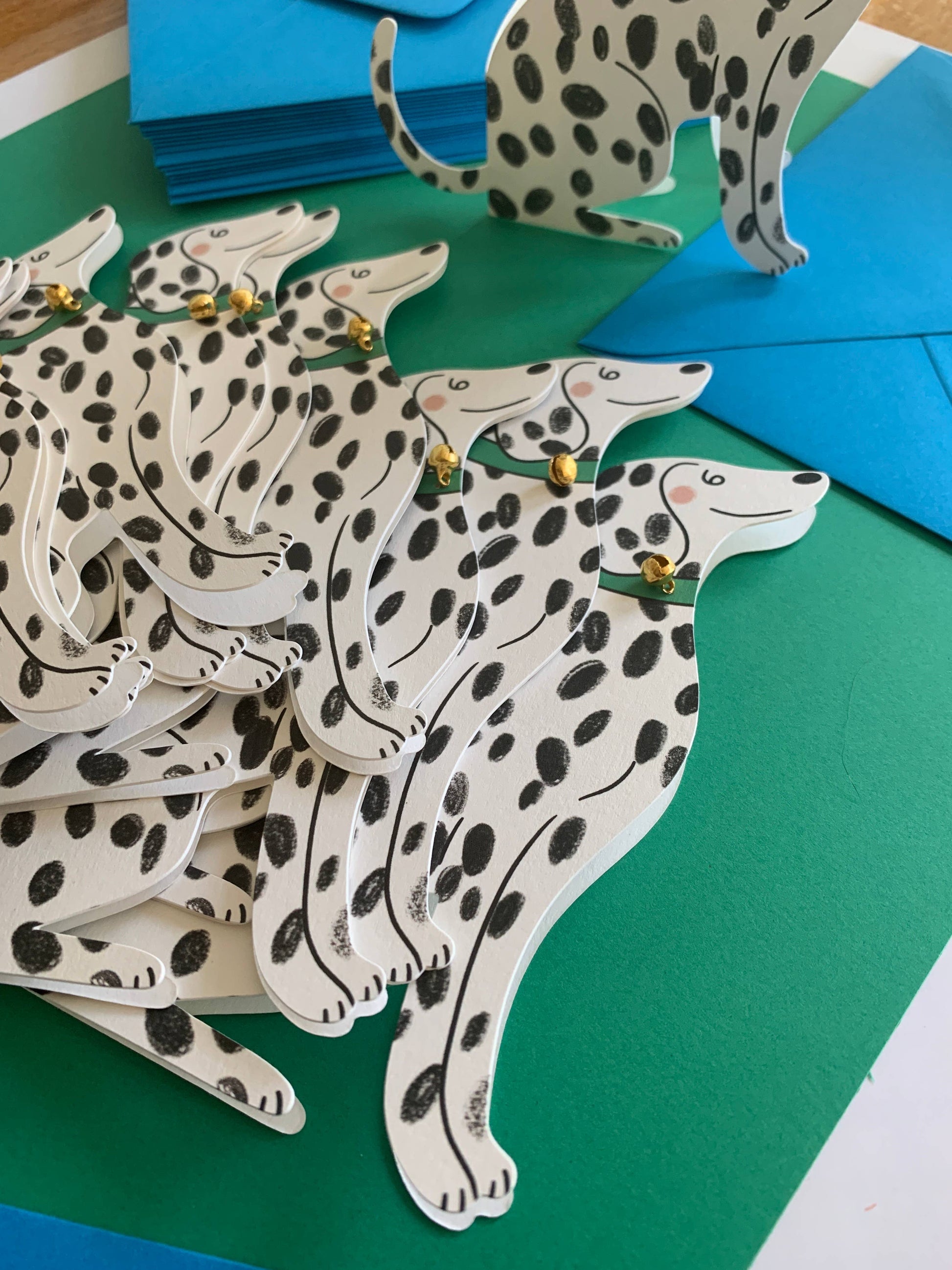 Sitting Dalmatian Shaped Greeting Card displayed in a styled flat lay
