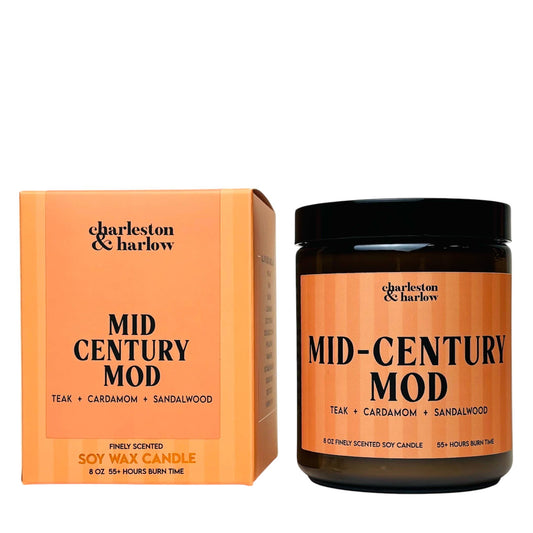 Charleston & Harlow Mid-Century Mod soy candle in amber glass jar with peach striped label, beside its matching gift box