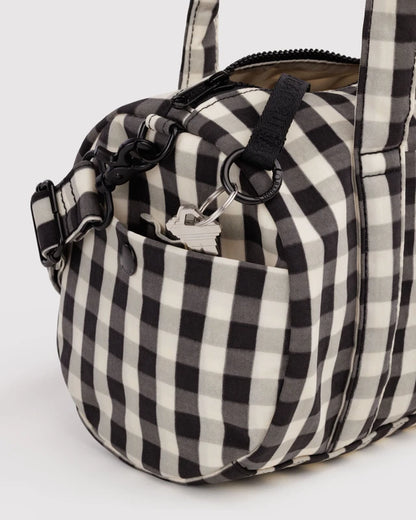 BAGGU Nylon Duffle Bag Black and Cream Gingham folded flat view - PABOOM