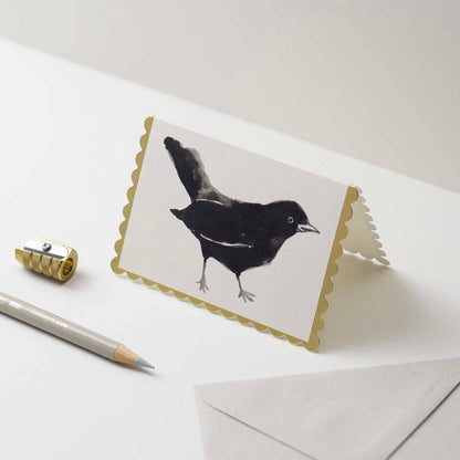 Single black bird illustration on cream mini card with gold foil scalloped edge