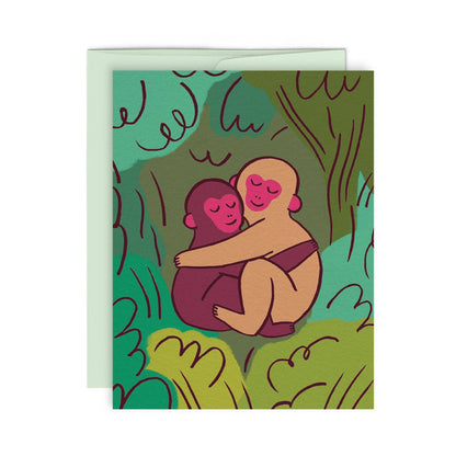 Two monkeys embracing with eyes closed in an illustrated jungle scene