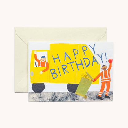 White greeting card with an illustrated yellow bin lorry and two waving workers, the truck's side reading 'Happy Birthday!,' ivory envelope alongside