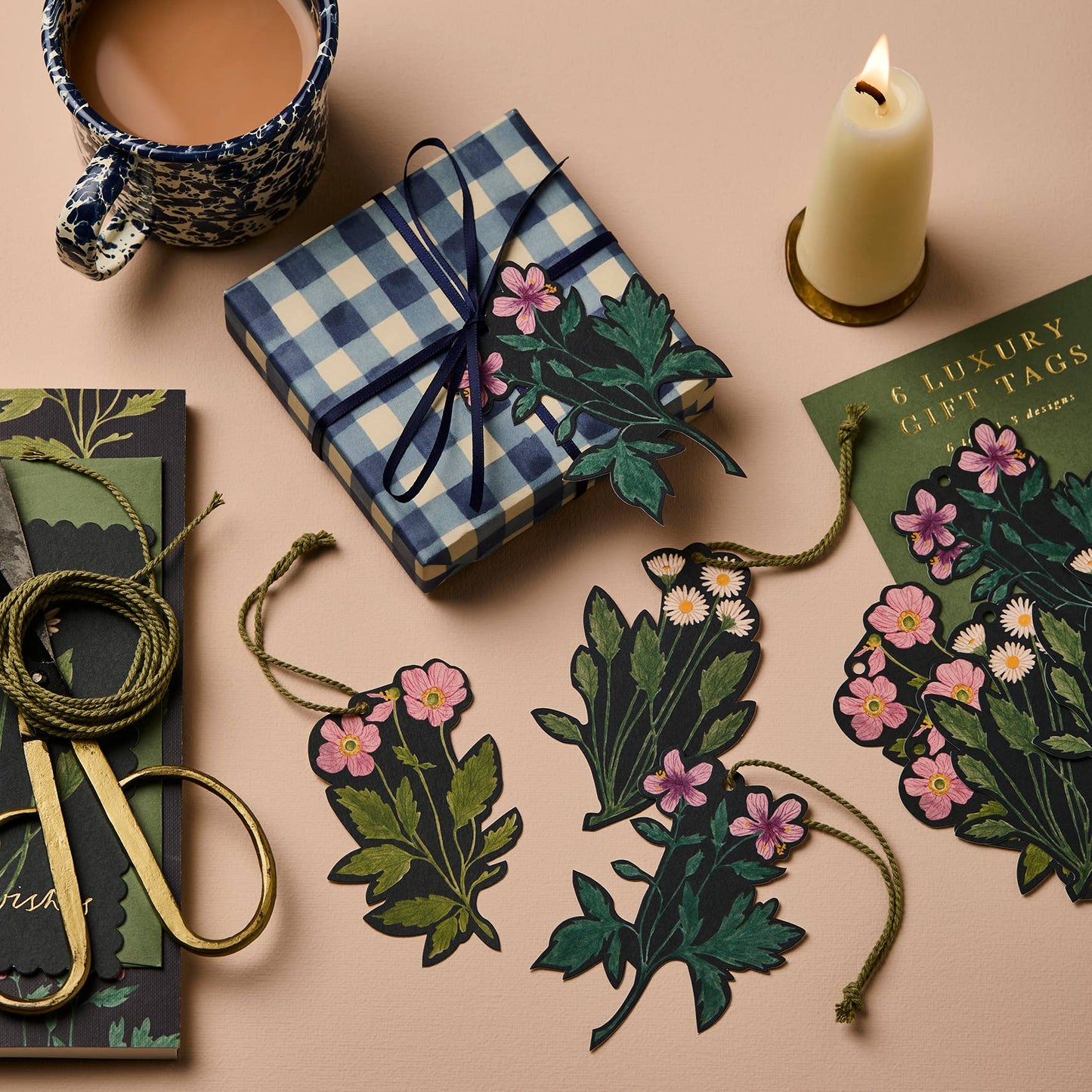 Botanical gift tags shown individually tied onto a wrapped present