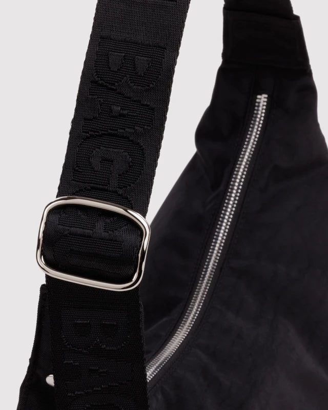 BAGGU Medium Nylon Crescent Bag Studs folded flat view - PABOOM