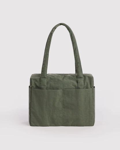 Interior view of the BAGGU Small Cloud Carry-On in caper green showing the detachable storage pouch