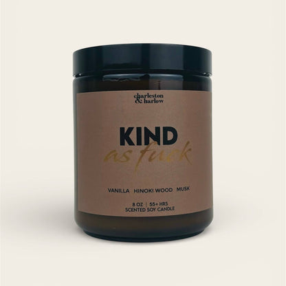 Charleston & Harlow Kind As Fuck soy candle in amber glass jar with warm brown label and gold script