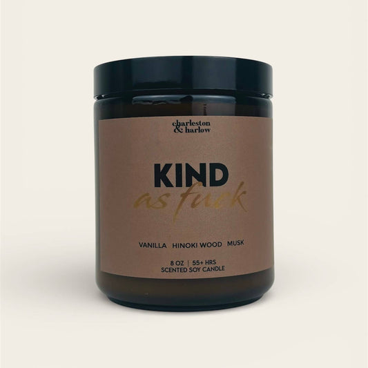 Charleston & Harlow Kind As Fuck soy candle in amber glass jar with warm brown label and gold script