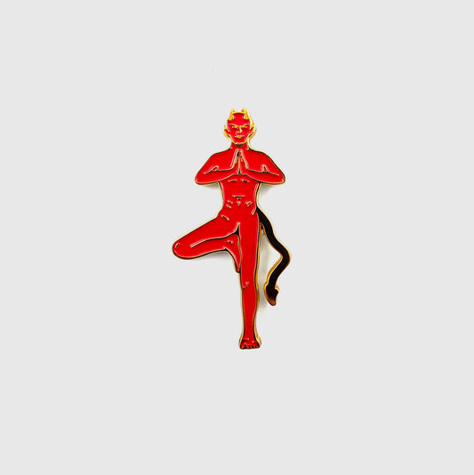 Red enamel pin of a devil figure in tree pose with horns and tail - PABOOM